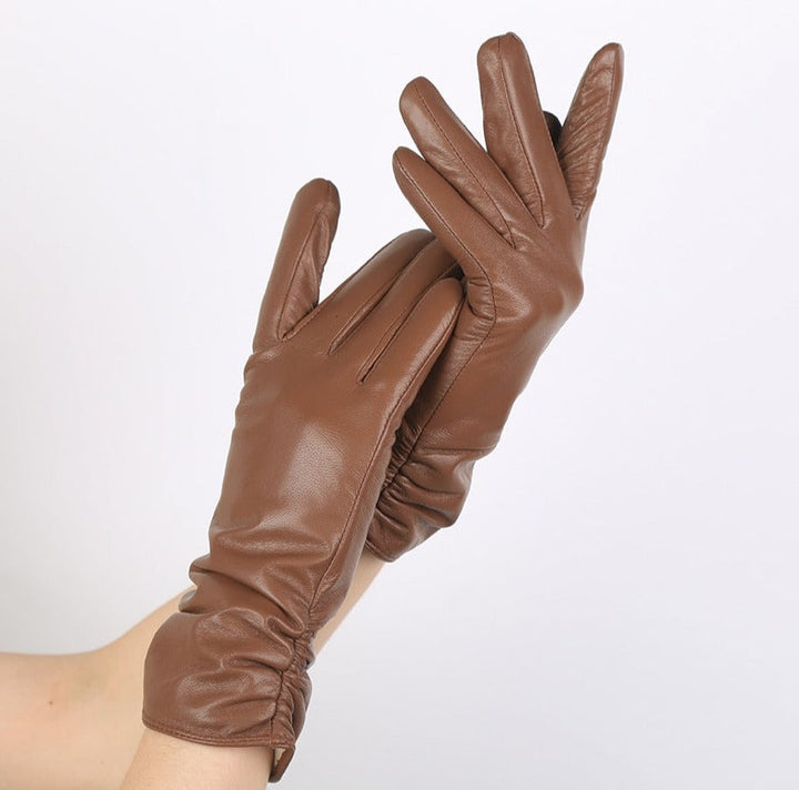 Classic women's genuine leather gloves, elegant fashion accessory, perfect for winter or driving.
