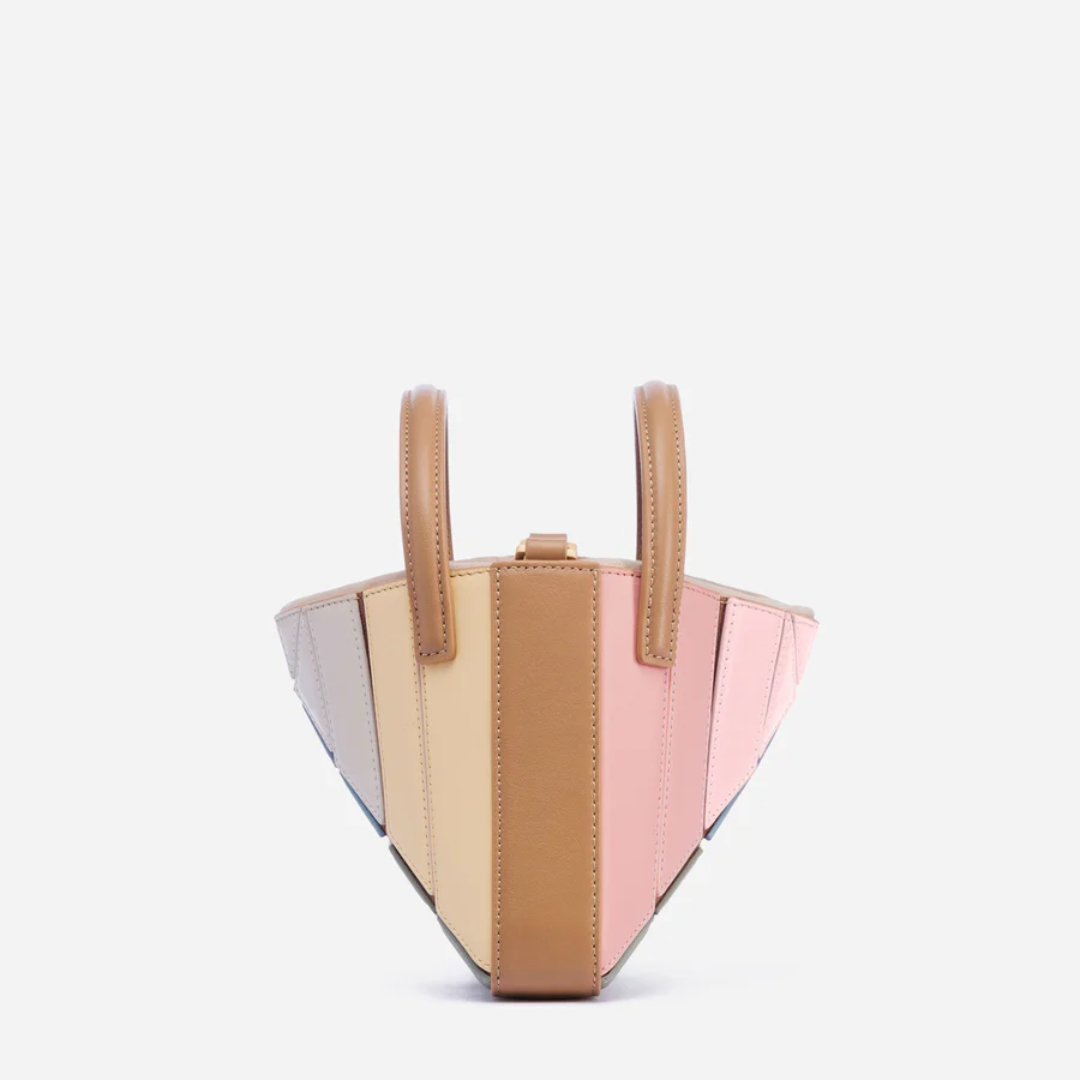Modern geometric women's handbag. A stylish fashion accessory and eye-catching everyday purse.