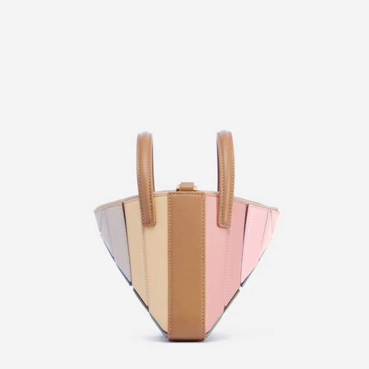 Modern geometric women's handbag. A stylish fashion accessory and eye-catching everyday purse.