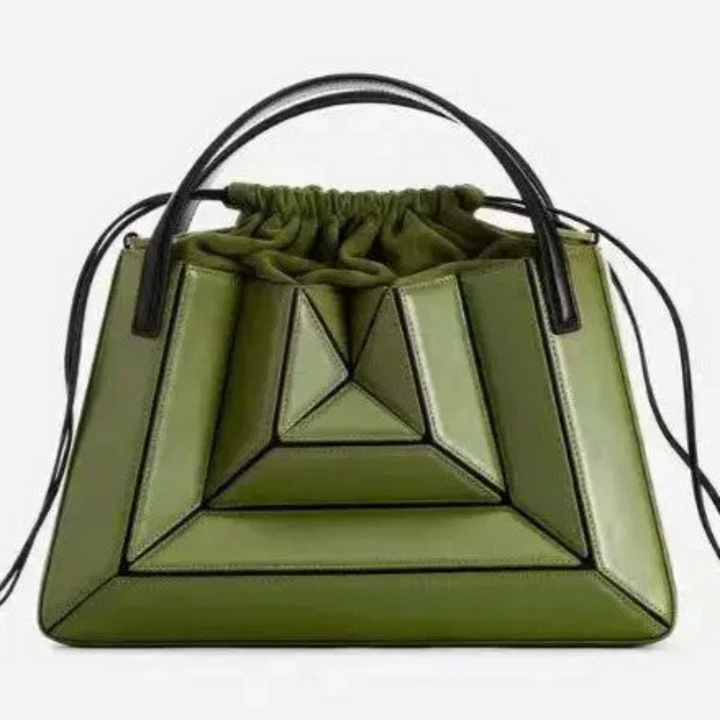 Chic women's shoulder bag featuring a unique geometric design. Modern fashion purse.