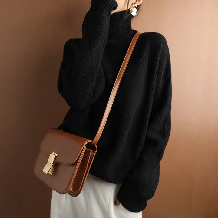Warm and cozy women's geometric high neck sweater, a must-have for winter fashion and comfort.