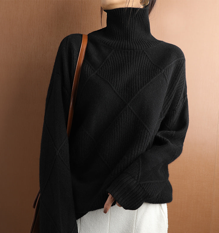 Stylish women's high neck sweater with a modern geometric texture, warm for winter days.