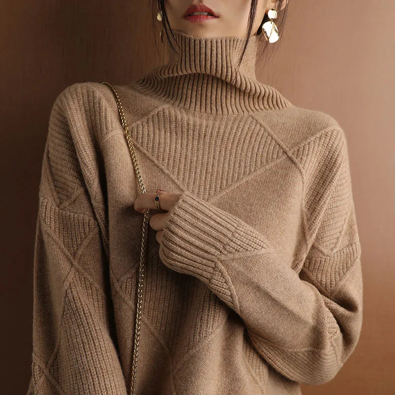 Autumn-winter women's sweater, geometric texture knit, high neck, offering warmth and style.