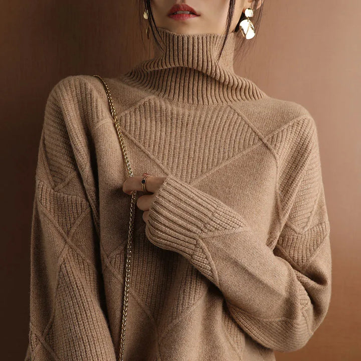 Autumn-winter women's sweater, geometric texture knit, high neck, offering warmth and style.