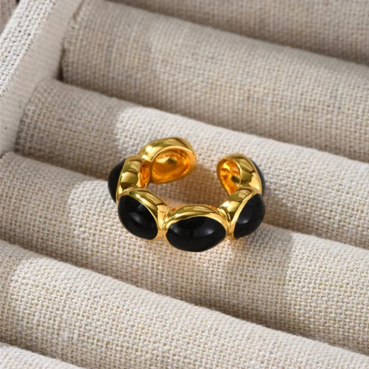 Mystical gilded onyx ring for women. Gold-plated gemstone ring, an elegant statement piece for any fashion lover.