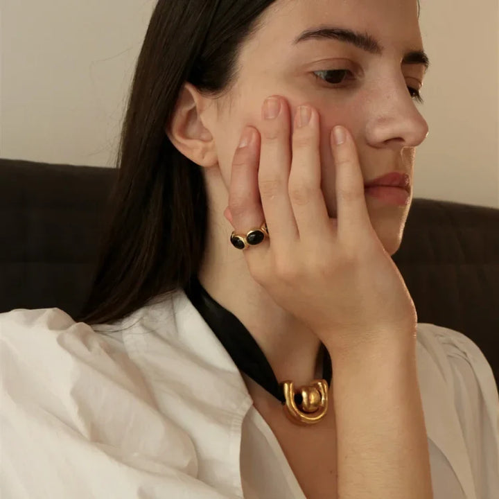 Versatile women's gilded onyx ring. Gold-plated gemstone jewelry, an elegant fashion accessory and statement piece.
