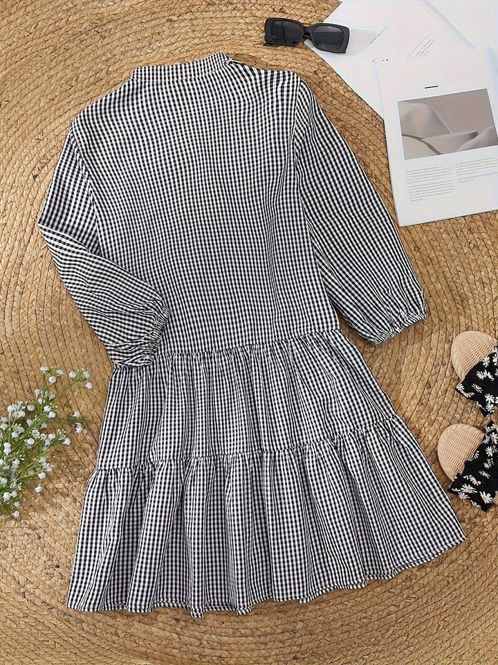 Versatile women's button-down tiered mini dress with a trendy gingham check and v-notch neckline.