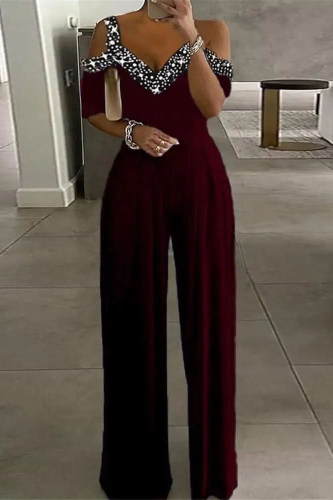 Women's glamorous black rhinestone jumpsuit. Perfect for evening wear, parties, and special occasions. Elegant & chic.