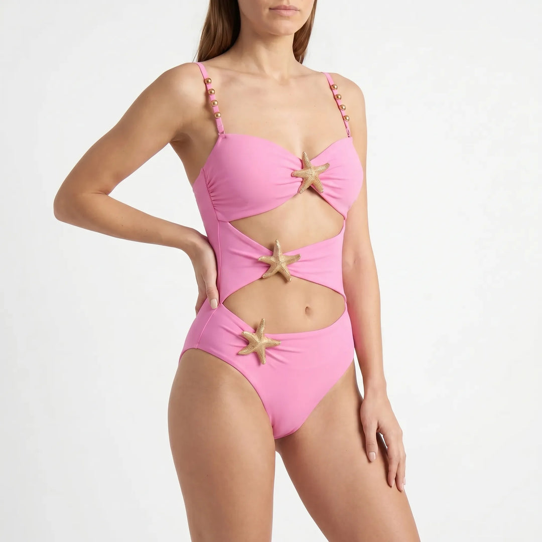 Model wearing a glamorous women's cutout monokini. Trendy women's swimwear for summer beach days.