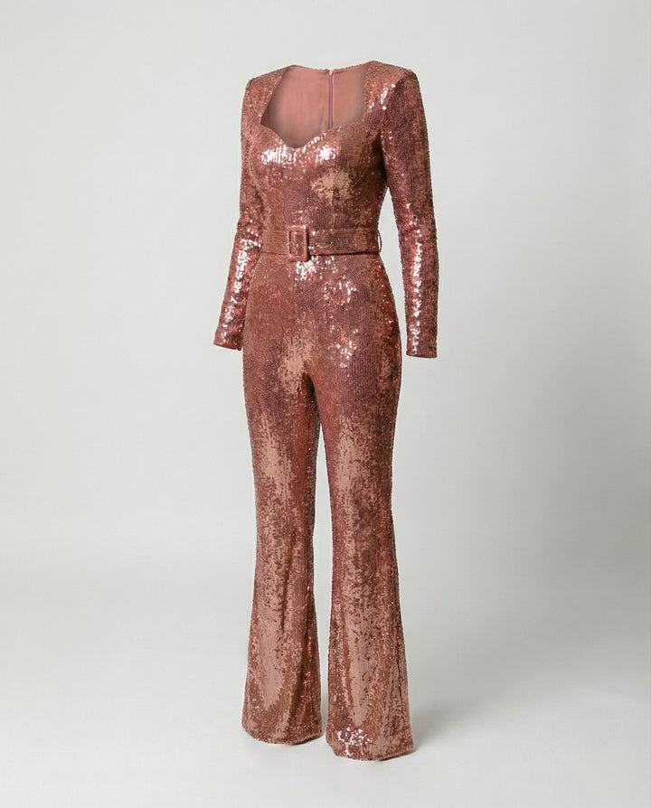 Close-up of shimmering sequins on a long-sleeve women's glamorous jumpsuit, perfect for evening events.