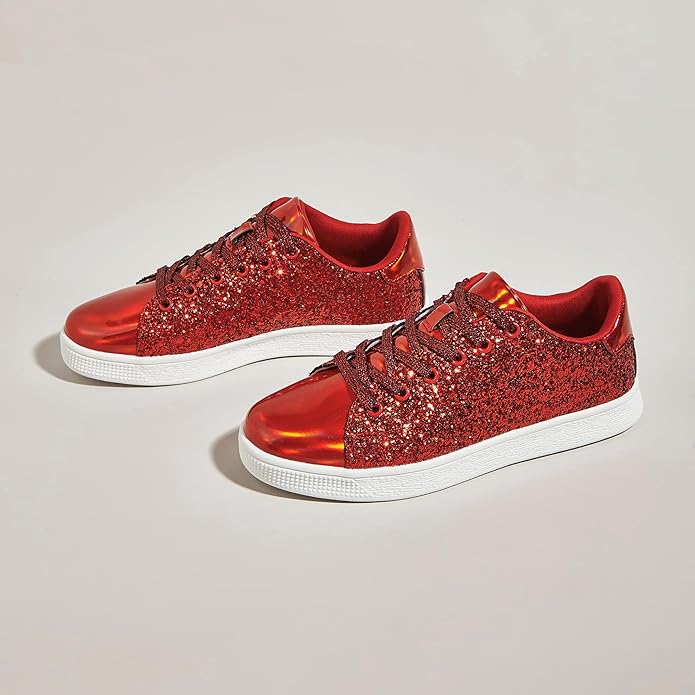 Pair of women's silver glitter sneakers with white laces, trendy sporty chic footwear