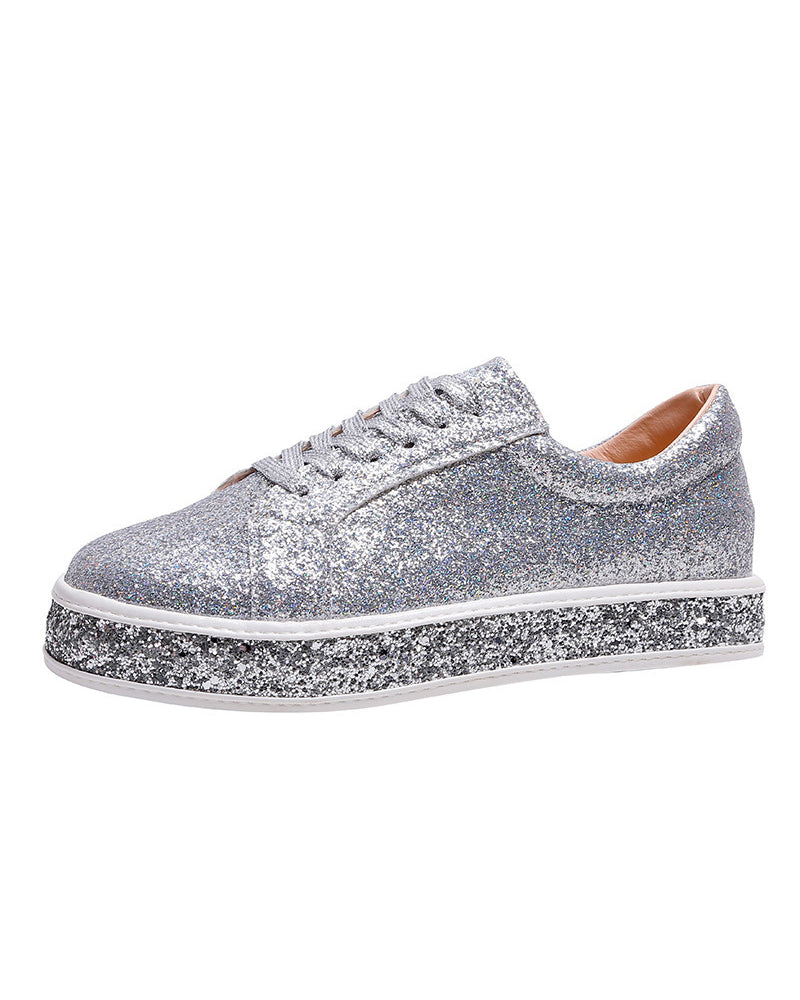 Elegant women's platform sneakers with subtle glitter, providing a chic and comfortable footwear option.