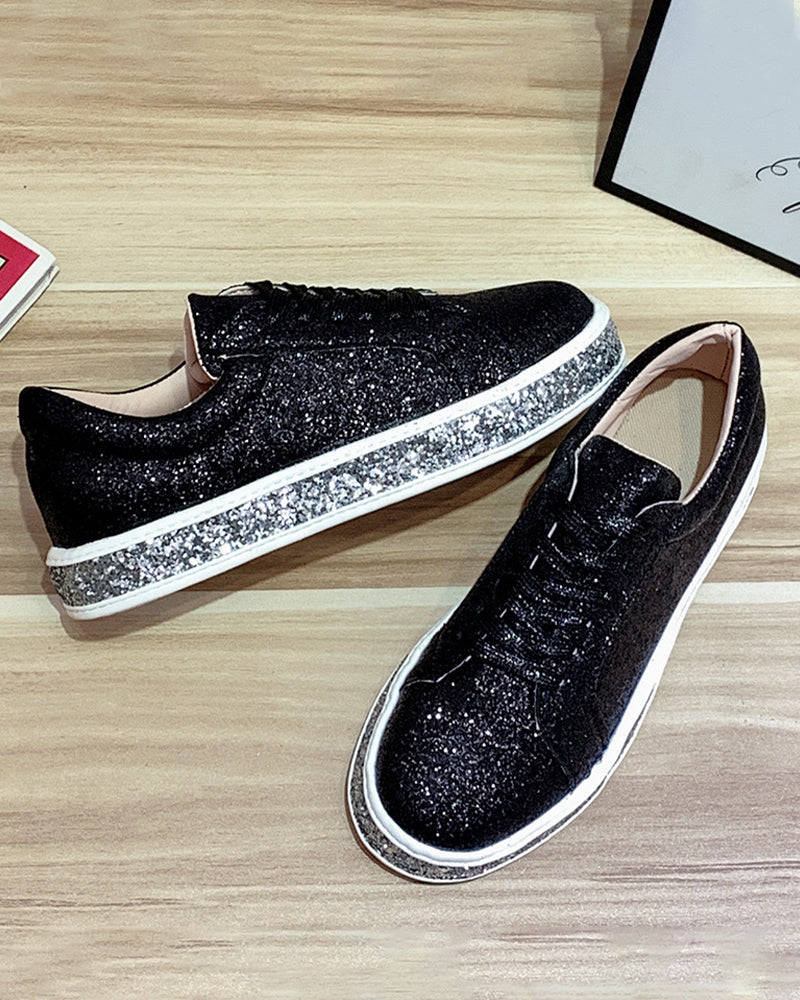 Comfortable women's sneakers featuring a trendy platform sole and eye-catching glitter finish.
