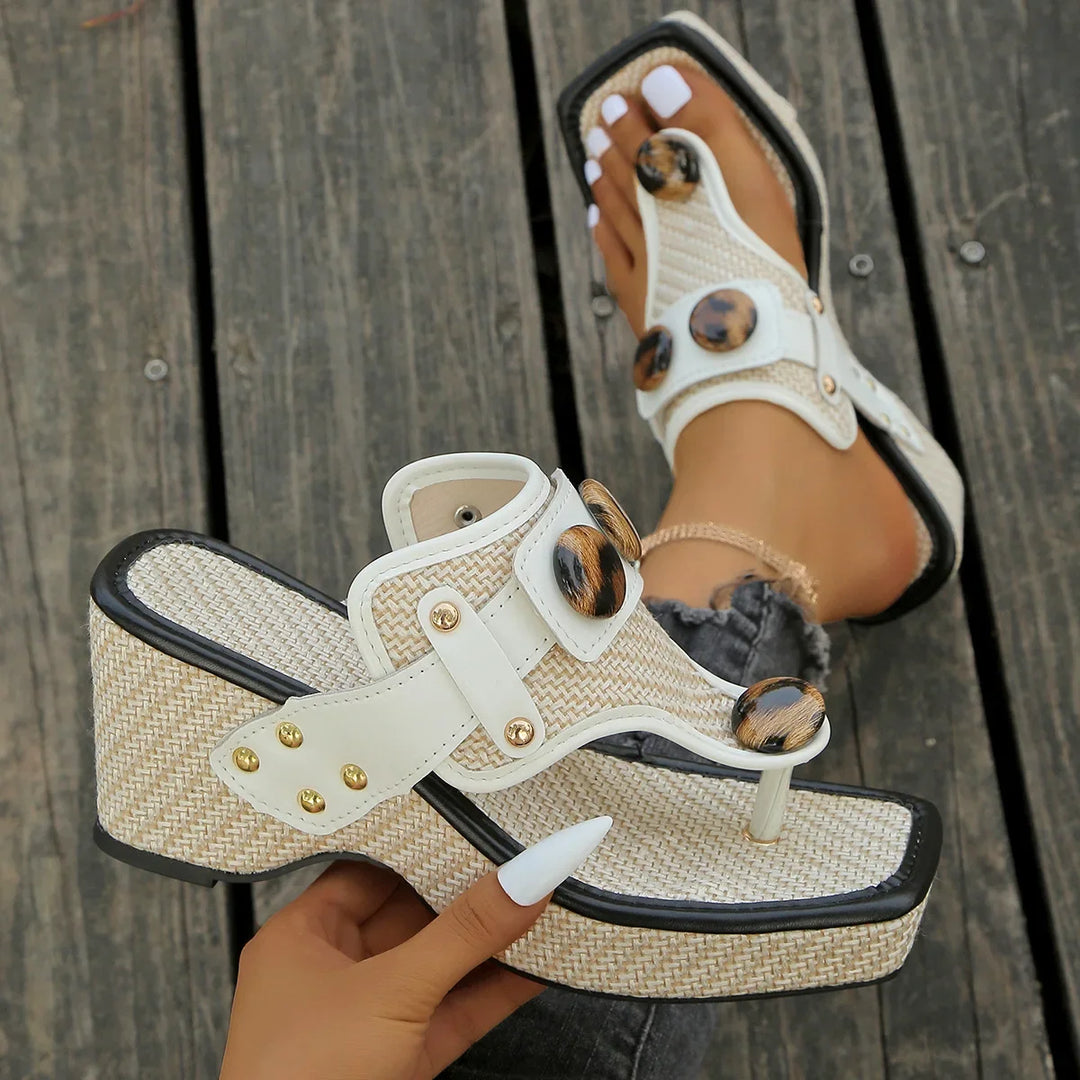 Women's summer platform slides with a sleek glossy appearance. Easy slip-on comfort.