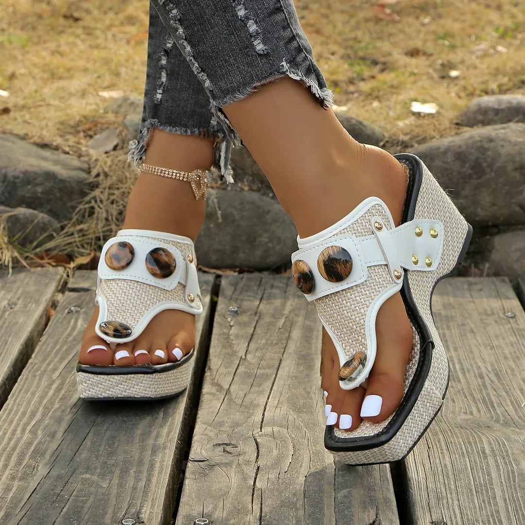 Stylish women's slip-on wedge slides with a glossy finish. Comfortable open-toe footwear.