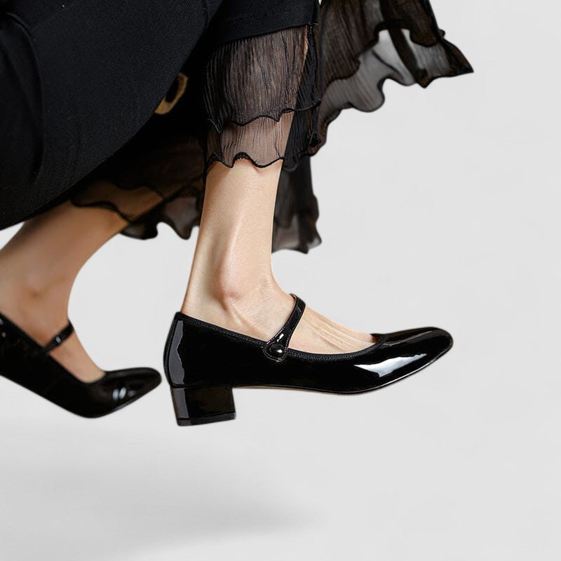 Polished women's Mary Jane shoes with a sleek glossy finish and stable block heel for an elegant appearance.