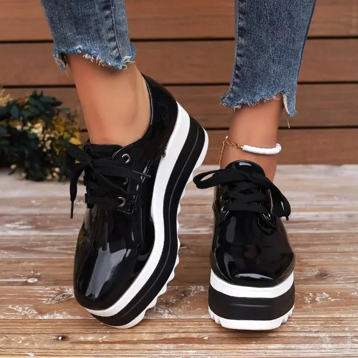 Women's comfortable glossy platform sneakers, featuring a durable sole & stylish design for active wear.