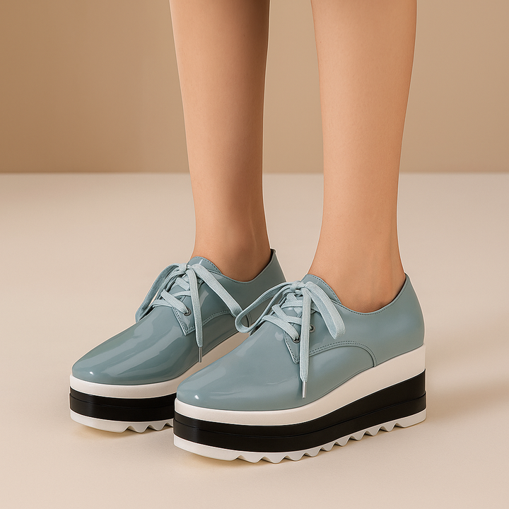 Side view of women's lace-up glossy platform sneakers, ideal for casual wear & everyday comfort.