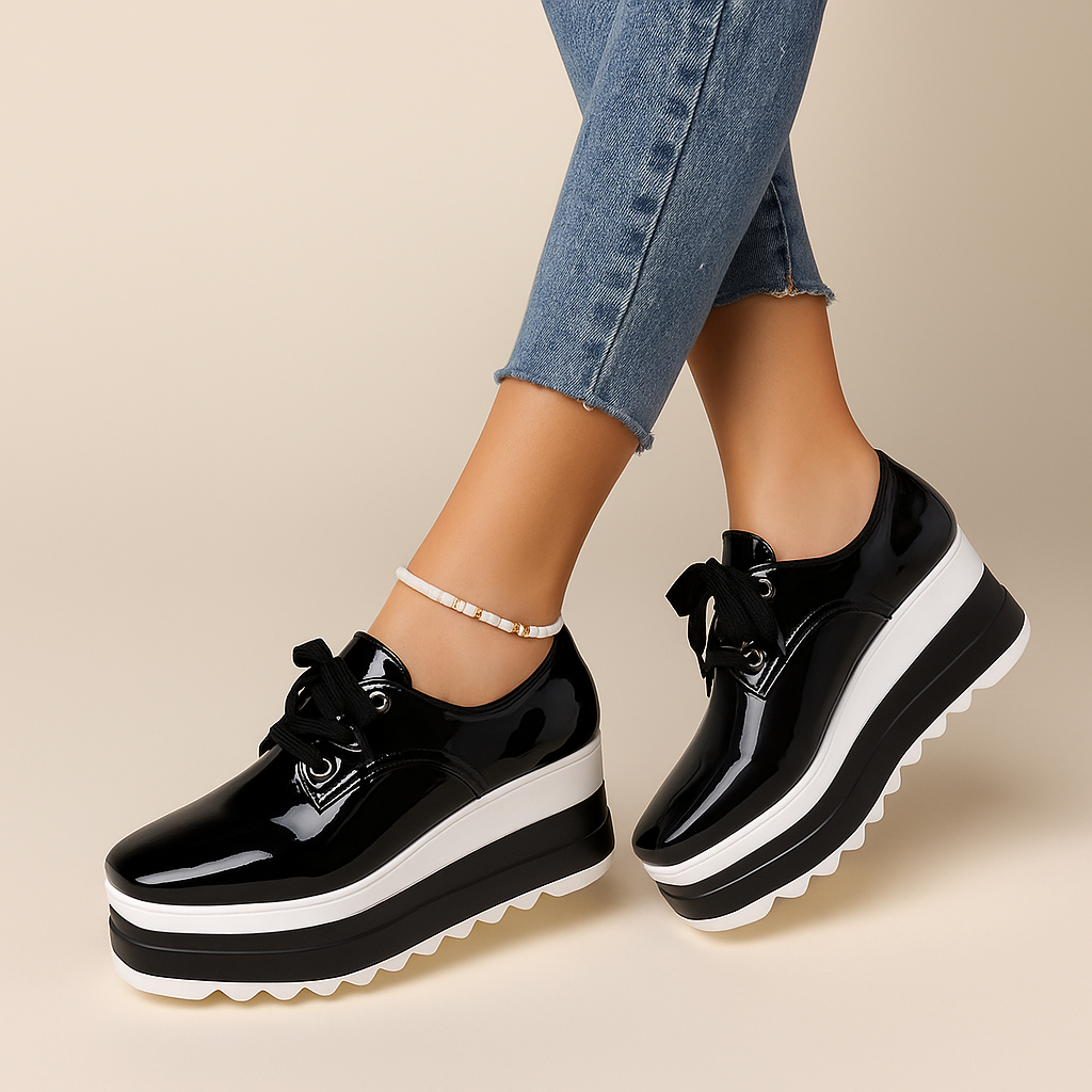 Front view of chic women's glossy platform sneakers, combining modern style with orthopedic support.