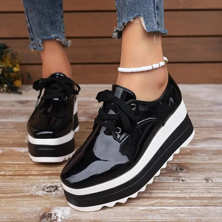 Woman wearing comfortable glossy platform sneakers, perfect for fashion, casual outfits & all-day wear.