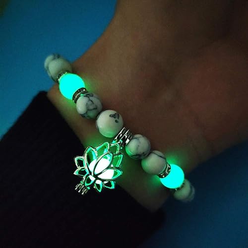 Close-up of a women's glow-in-the-dark lotus bracelet, featuring a luminous charm.