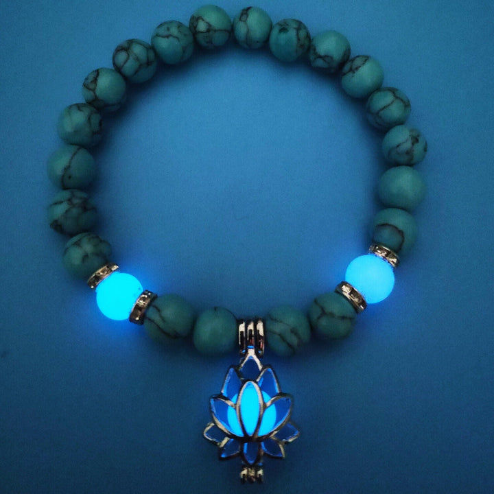 Radiant women's glow lotus bracelet, elegant luminous jewelry charm for night.