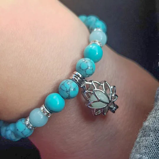 Women's elegant glow-in-the-dark lotus bracelet, shining brightly in the dark.