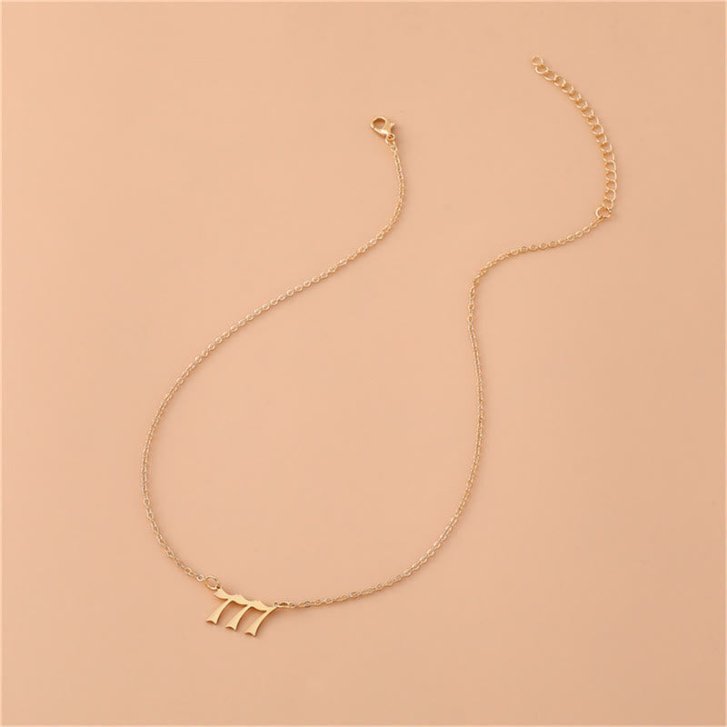 Gold-tone angel numbers necklace, stainless steel, women's symbolic spiritual jewelry.