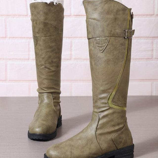 Versatile women's knee high boots for fall/winter, featuring a stylish gold buckle, block heel & robust lug sole.