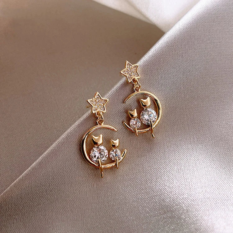Elegant gold cat ear stud earrings, dazzling with clear zirconia. Beautiful women's feline jewelry with a subtle sparkle.