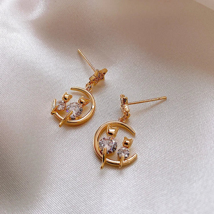 Unique gold cat ear stud earrings, adorned with sparkling zirconia stones. A charming animal lover's gift for women.