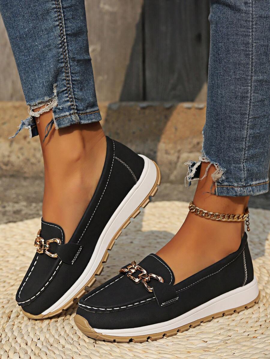 Women's comfortable slip-on flatform loafers with gold chain detail. Round toe for classic modern style.
