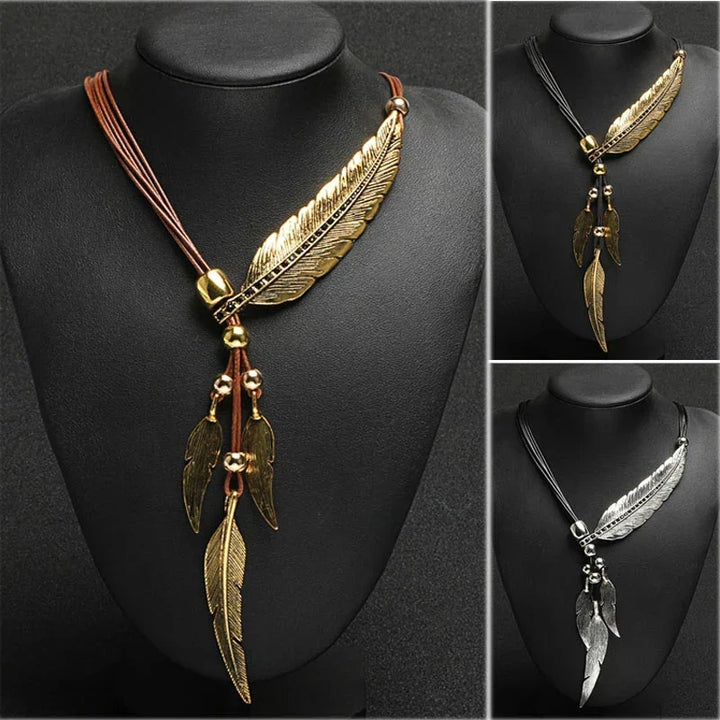 Adjustable gold feather necklace. Women's boho-chic jewelry featuring a beautifully detailed feather pendant.