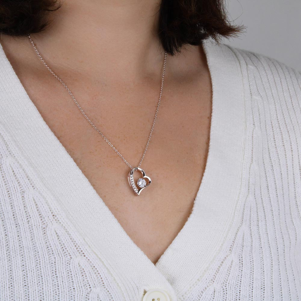 Sparkling heart zirconia pendant on a gold plated necklace for women. Dainty jewelry.