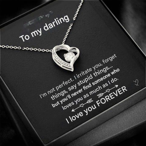 Dainty gold finish necklace featuring a brilliant heart-shaped zirconia pendant. Womens jewelry.