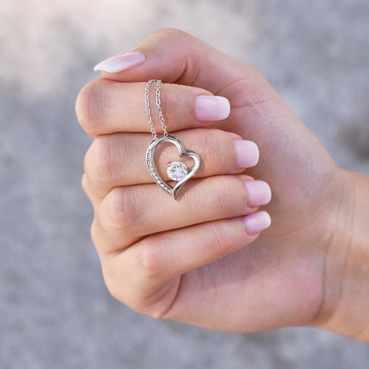 Women's gold heart necklace with dazzling zirconia pendant. Timeless jewelry gift.