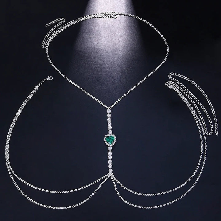 Silver rhinestone heart pendant body chain, women's chest jewelry, sparkling statement accessory.