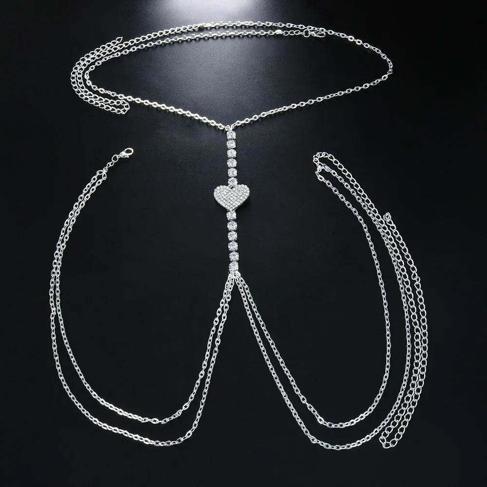 Gold women's heart rhinestone body chain, dazzling chest jewelry, trendy fashion accessory.