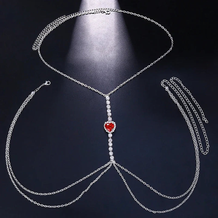 Women's elegant heart rhinestone body chain, dazzling chest jewelry, chic fashion accessory.