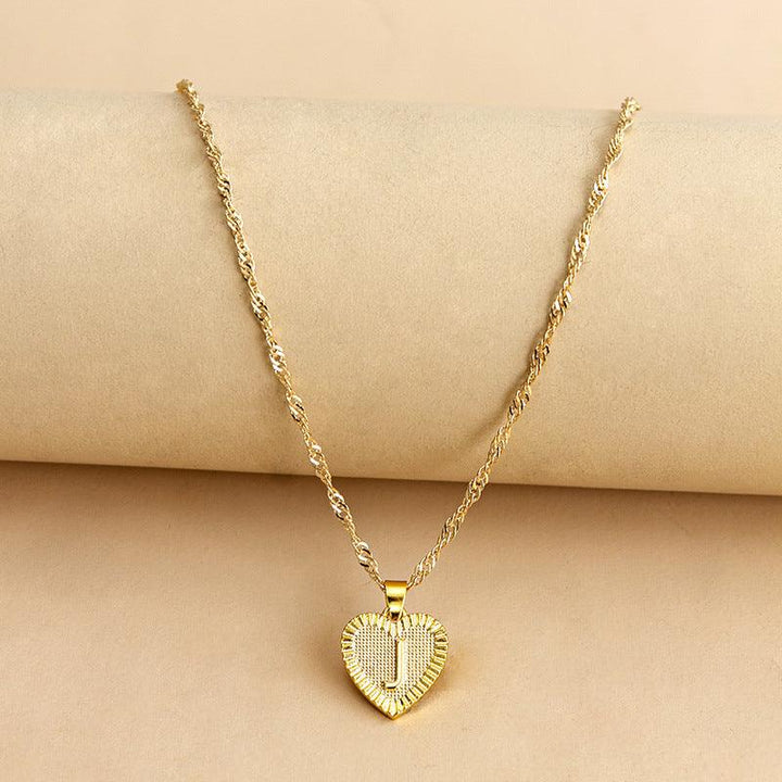 Fashionable gold initial heart necklace, a special personalized women's accessory.