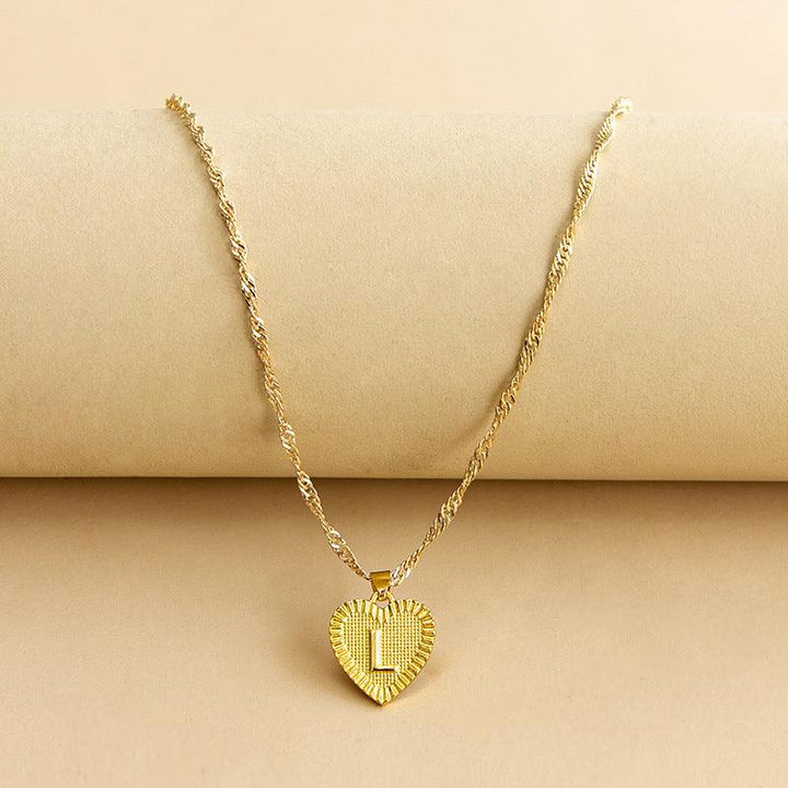 Custom initial gold heart necklace, a cherished gift for birthdays or anniversaries.