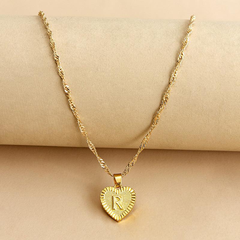 Gold heart necklace with initial, a thoughtful custom gift for any occasion.