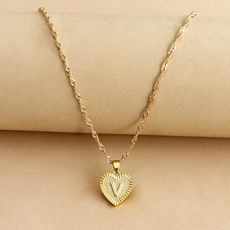 Glistening gold initial heart necklace, personalized and elegant for women.