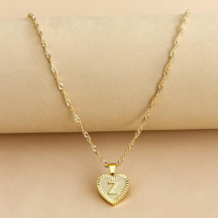 Personalized gold heart necklace with initial, a beautiful custom Valentine's gift.