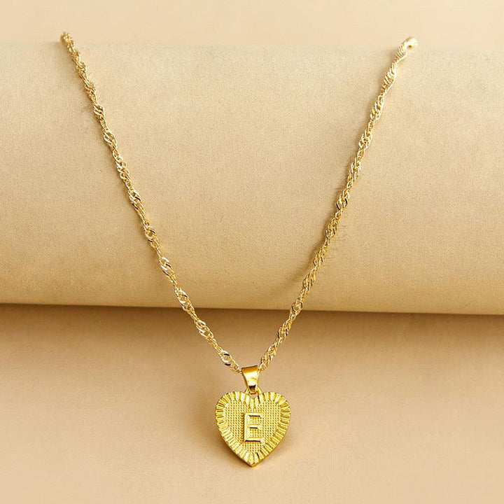 Stylish gold heart initial necklace, ideal custom birthday or anniversary gift.