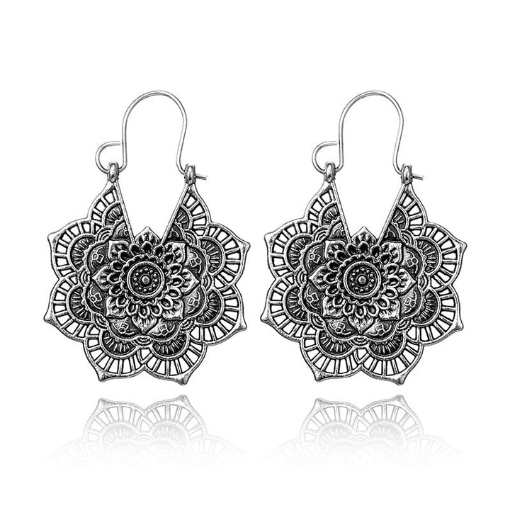 Delicate silver lotus mandala drop earrings, perfect for women's boho & spiritual styles.