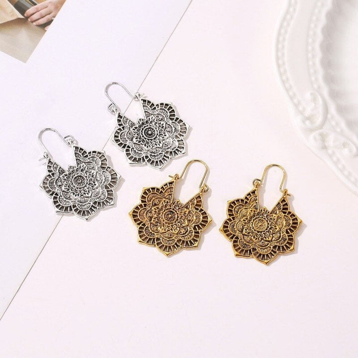 Dainty gold lotus mandala drop earrings, spiritual & elegant women's boho jewelry accessory.