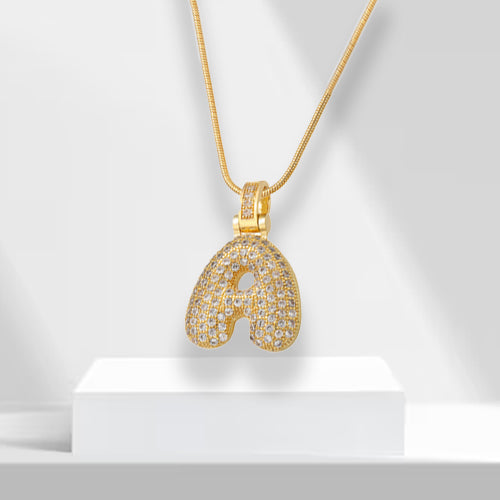 Women's gold plated bubble letter initial pendant necklace with zirconia. A glamorous statement accessory.
