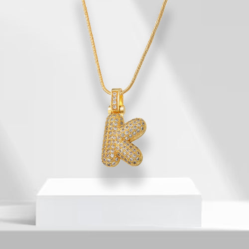 Glamorous women's gold plated bubble letter 'R' pendant necklace, sparkling with zirconia.