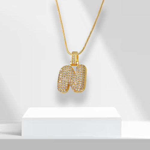 Eye-catching bubble letter statement necklace for women, gold plated with brilliant zirconia.